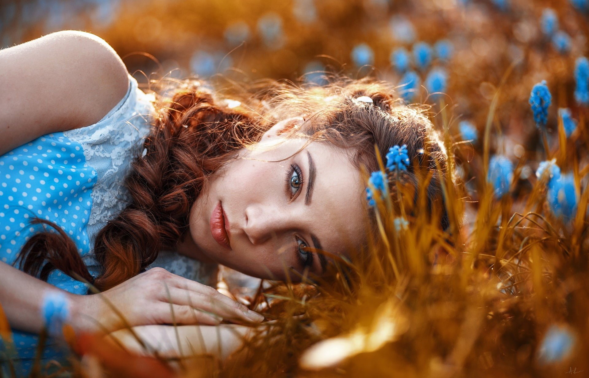 Image showing girl laying on a garden, rich with hair